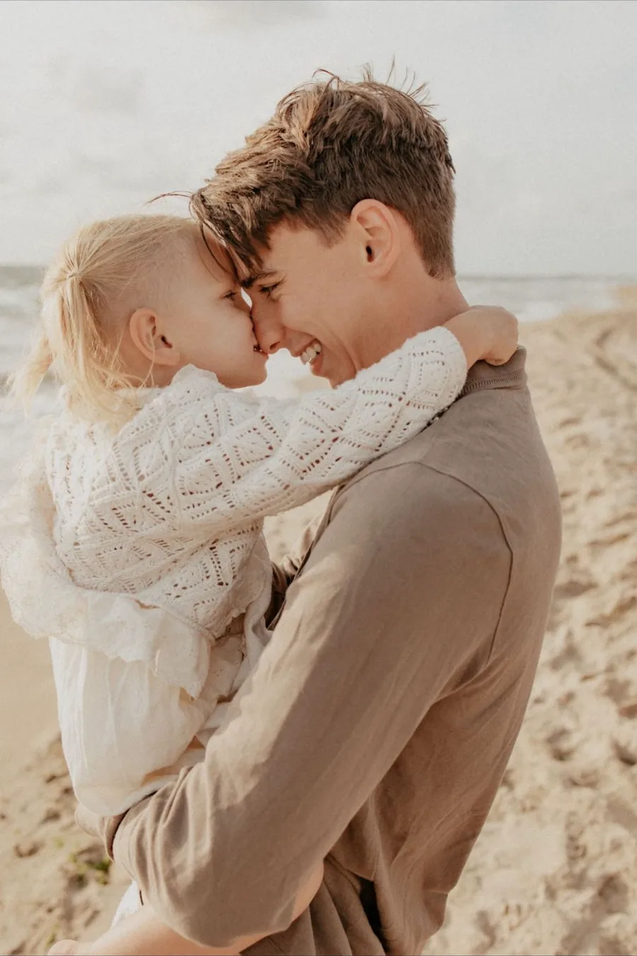 Jordan, owner of English Plumber, on the beach with his daughter